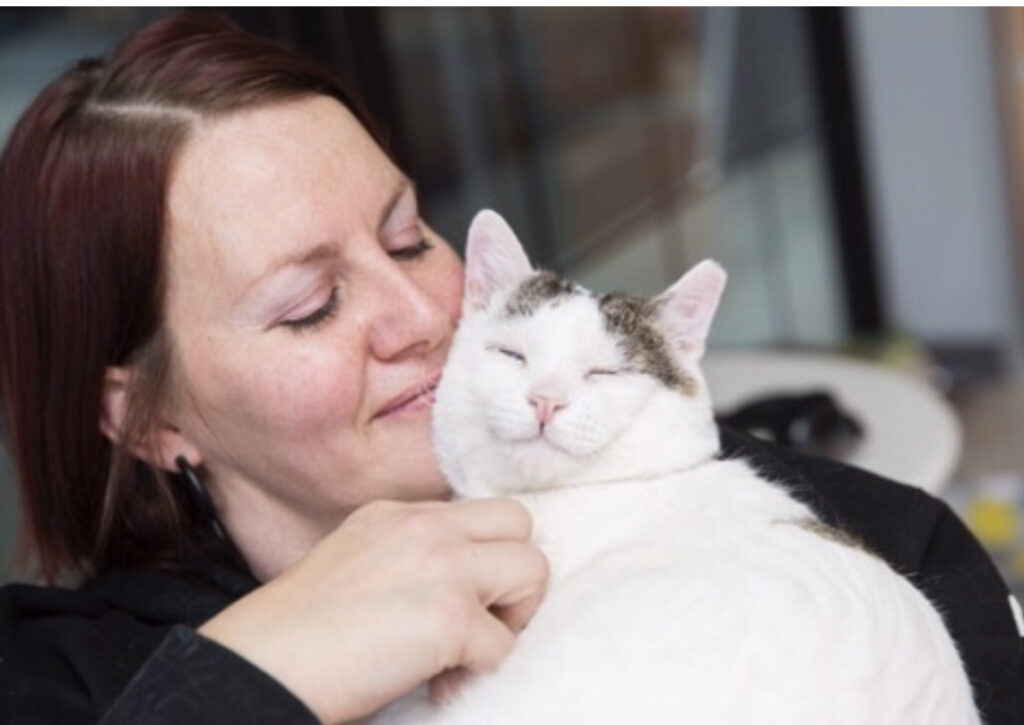 Jessica Vigos holding a rescued cat